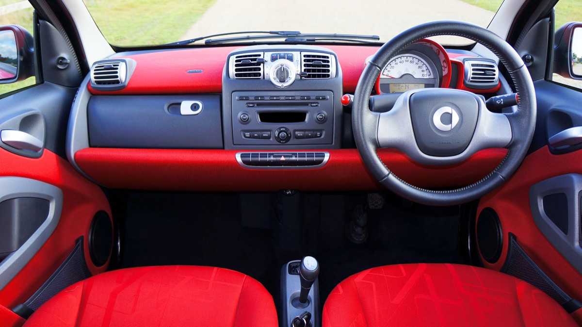 Close-up of a modern car's gear selector and control knob